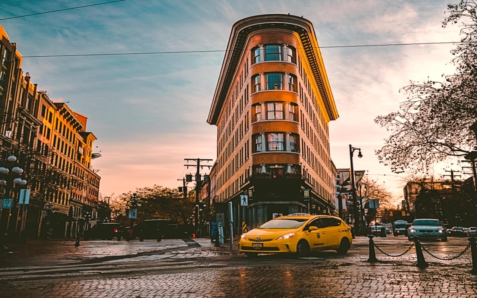 A taxi drives through Vancouver’s Gastown