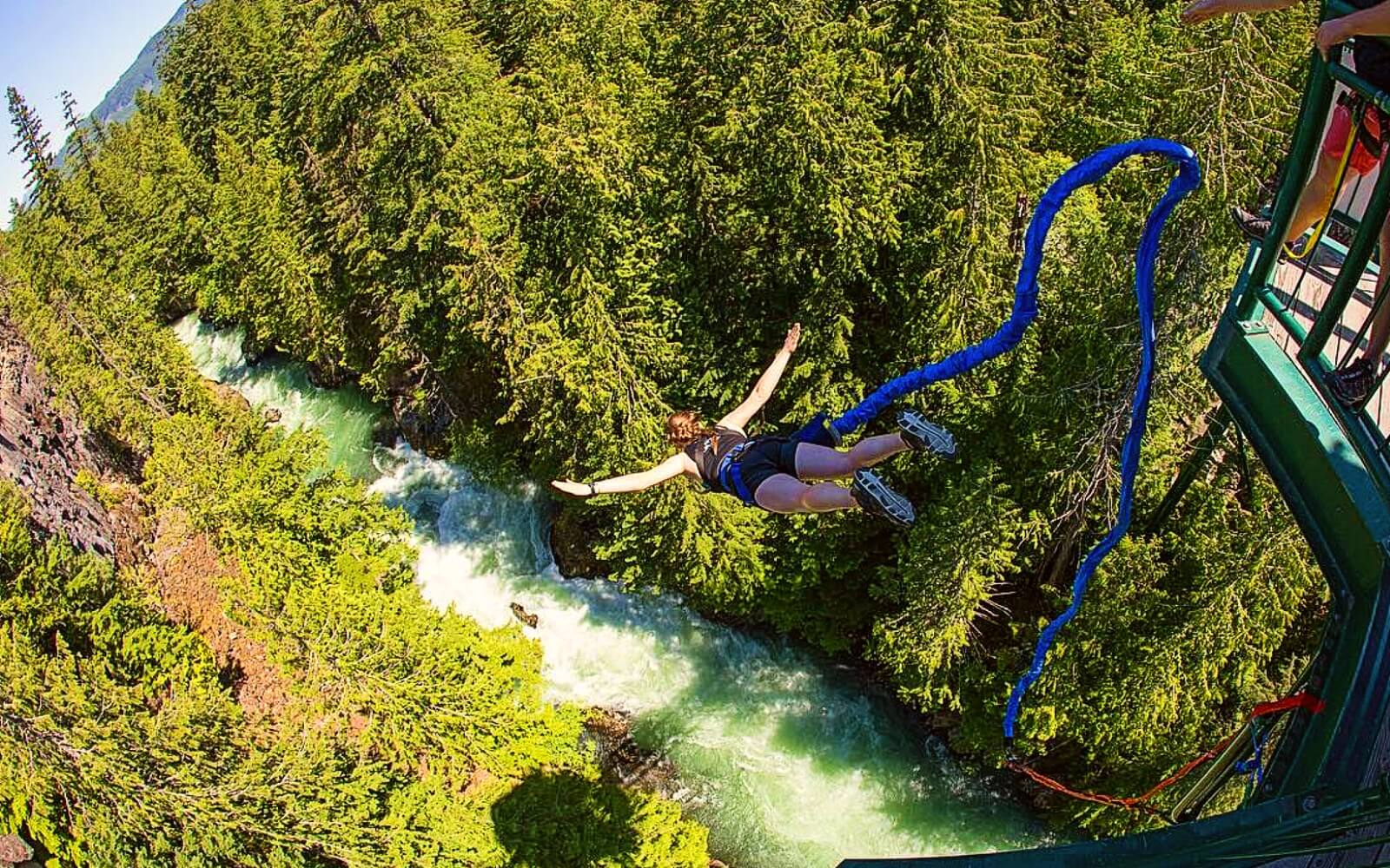 A customer dives off the bridge at Whistler Bungee