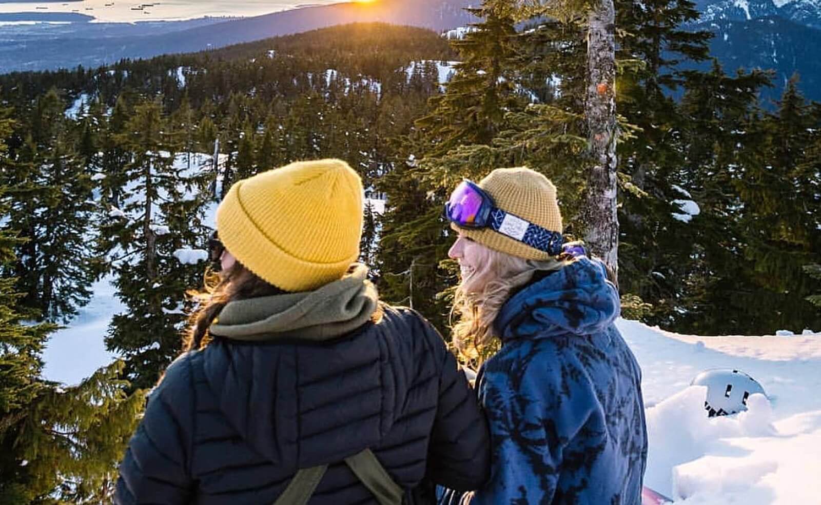 A pair of girls glance out from the top of Mount Seymour