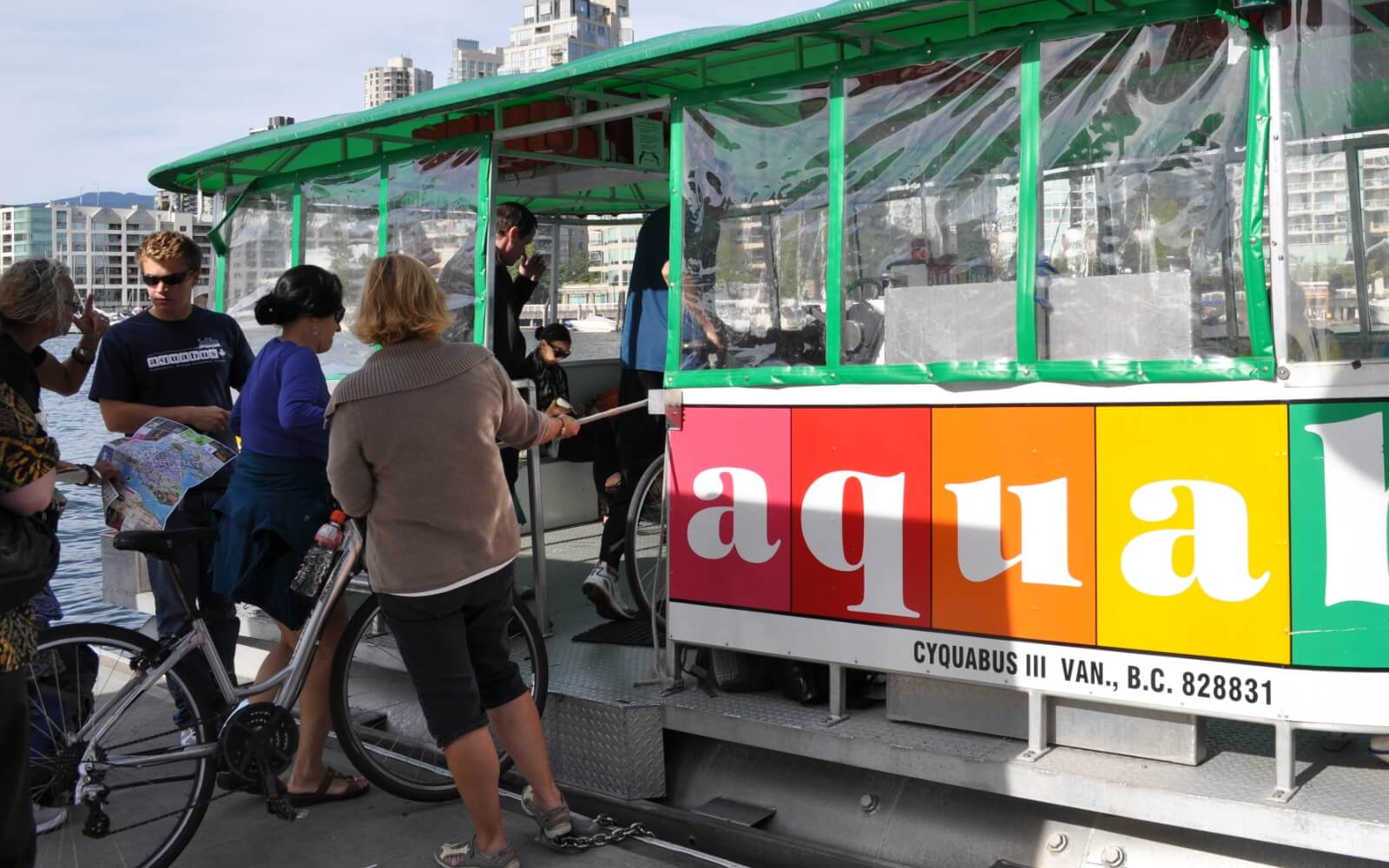 tourist boarding the aquabus at granville island in vancouver canada