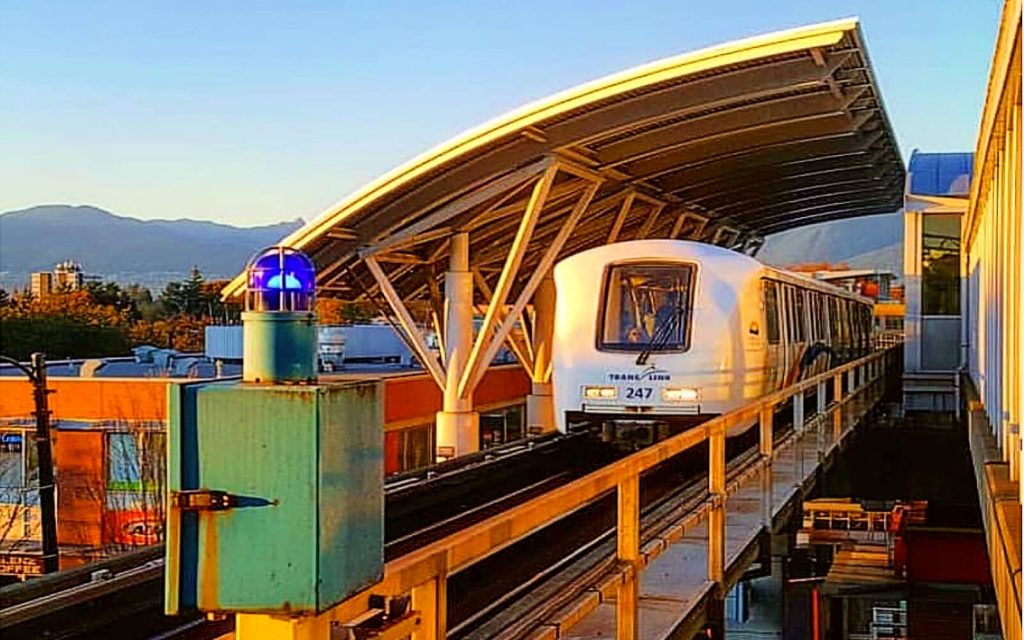 skytrain arrives at a station in vancouver canada