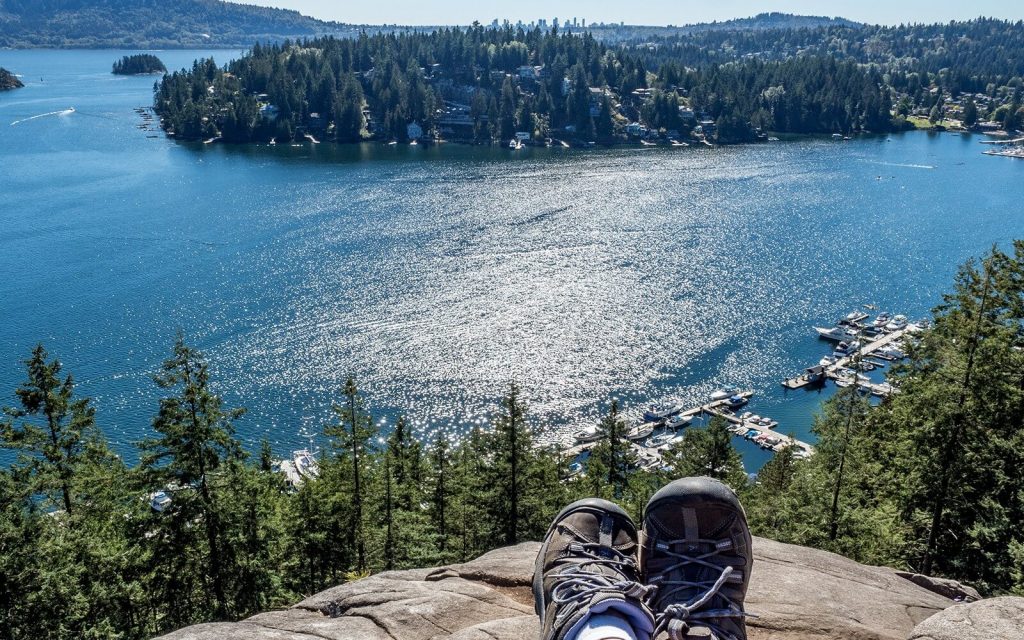 a hiker relaxes on quarry rock in north vancouver bc canada