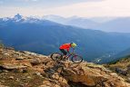 A mountain biker in front of a mountain vista