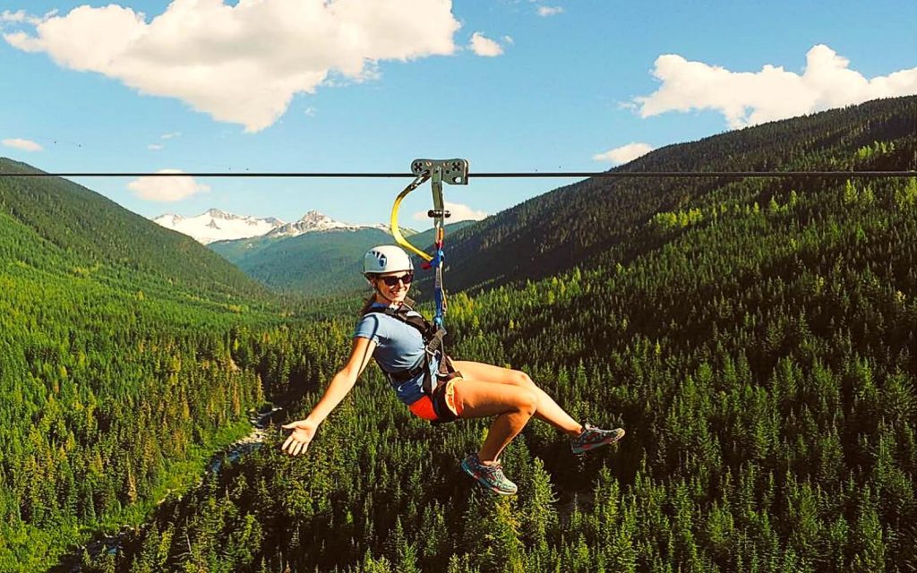 A woman ziplines in Whistler, BC
