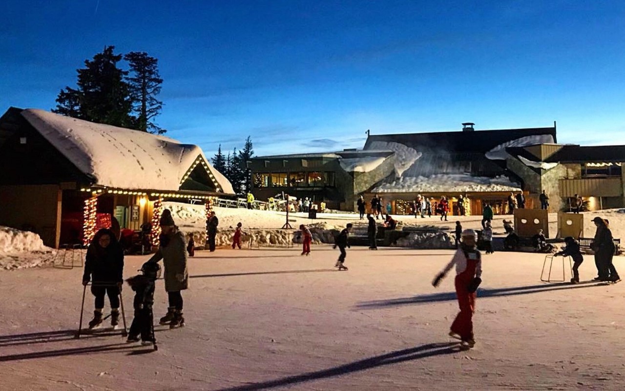 Families skate on a mountaintop skating rink, Grouse Mountain Vancouver