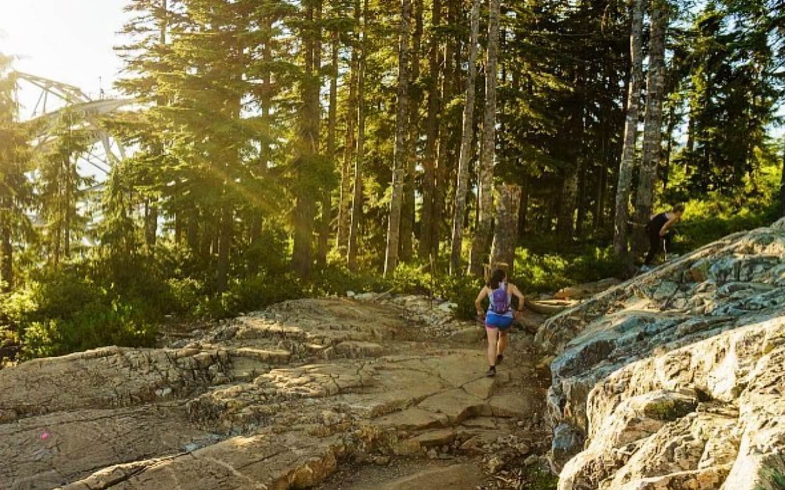 A woman completes the Grouse Grind