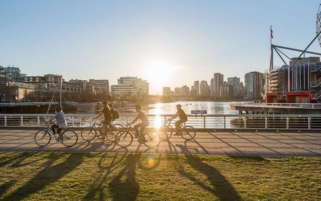 A cycle city tours passes Creekside park, vancouver