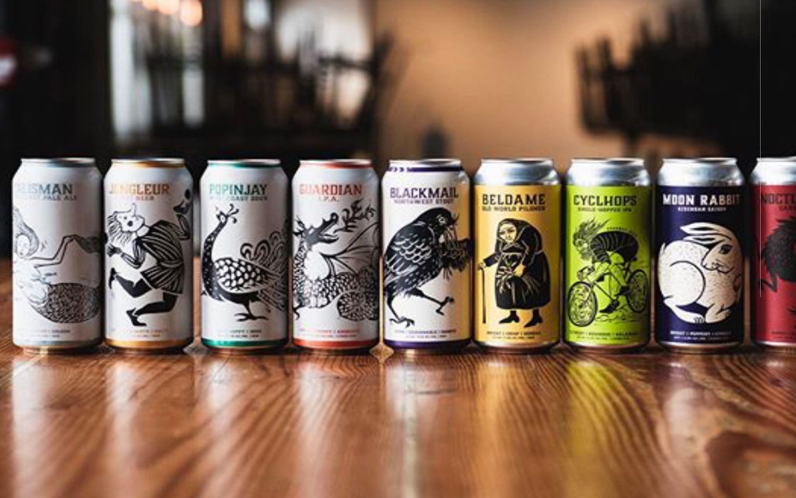 A selection of tall cans sit on the bar at Strangefellows Brewing, East Vancouver
