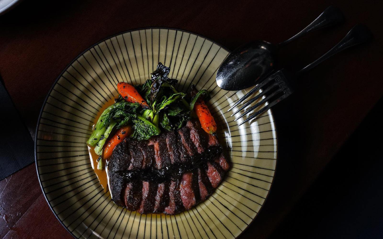 sliced steak at kissa tanto restaurant in vancouver bc canada
