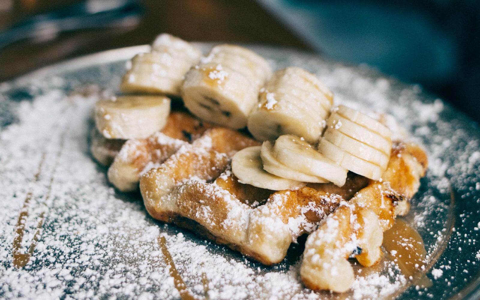 waffles with bananas and maple syrup at twisted fork vancouver canada