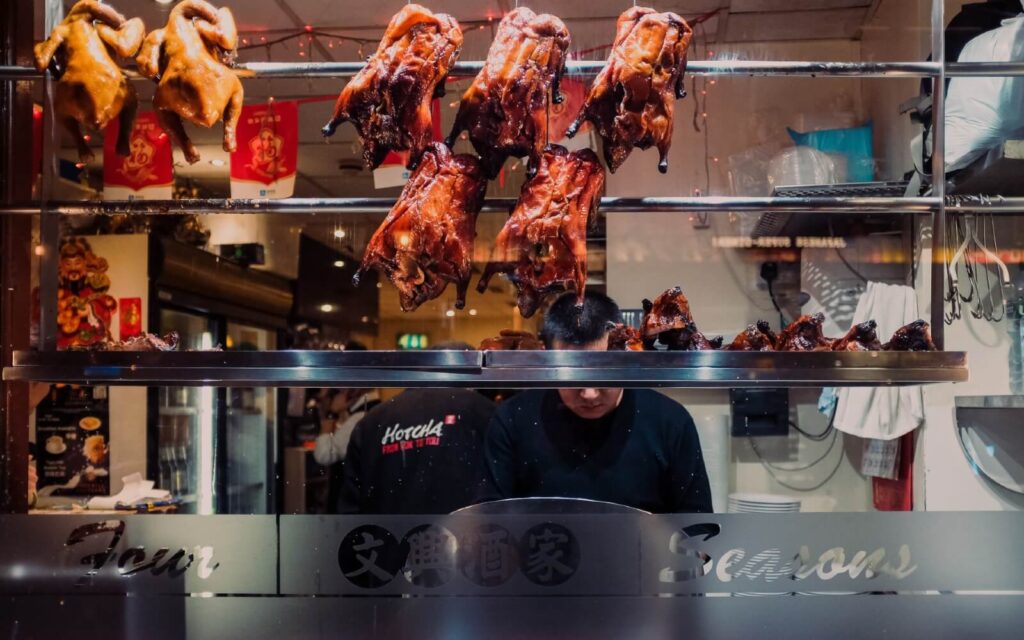 roasted duck hanging in a window in chinatown vancouver
