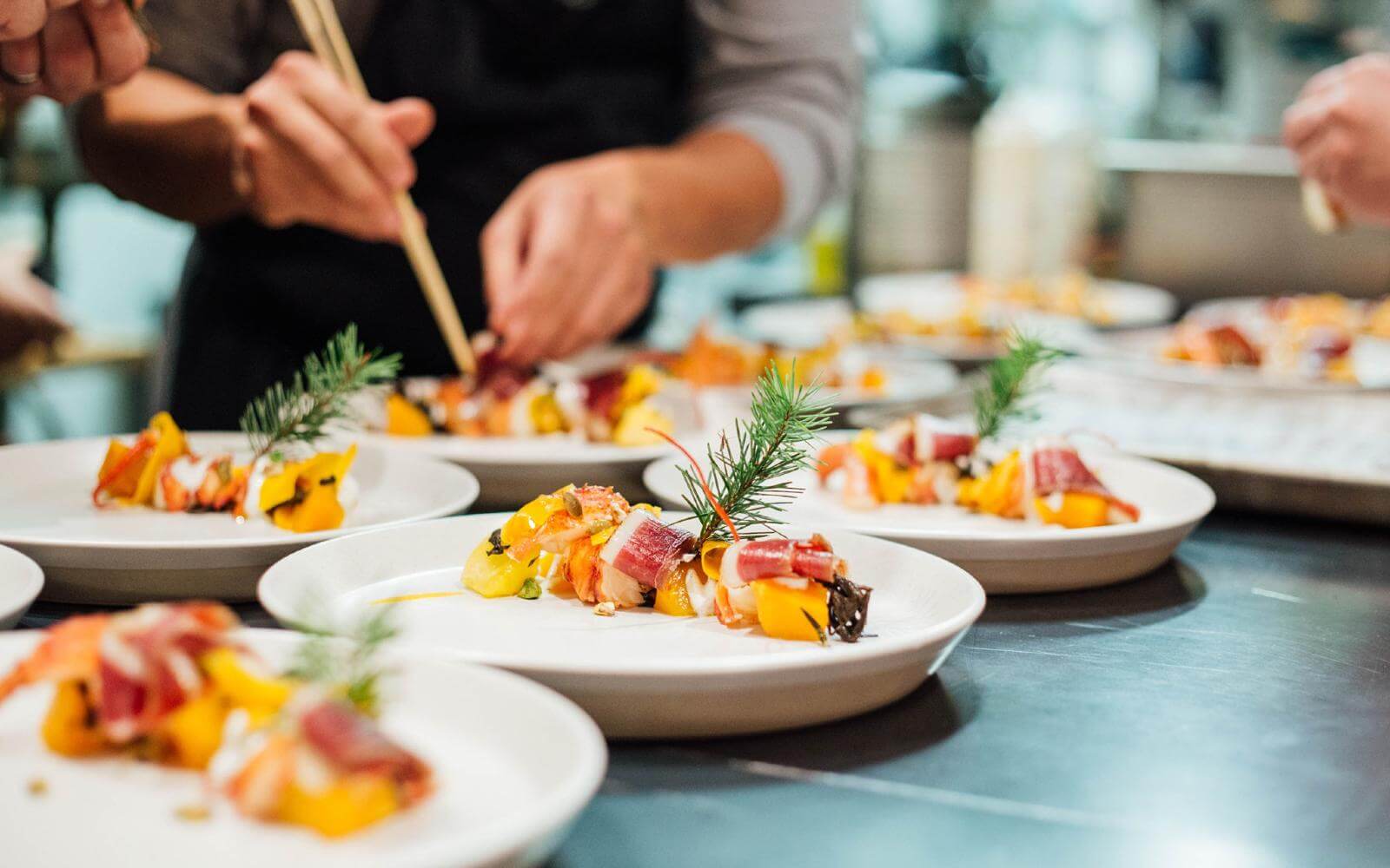 a chef preparing a starter during dine out vancouver bc canada