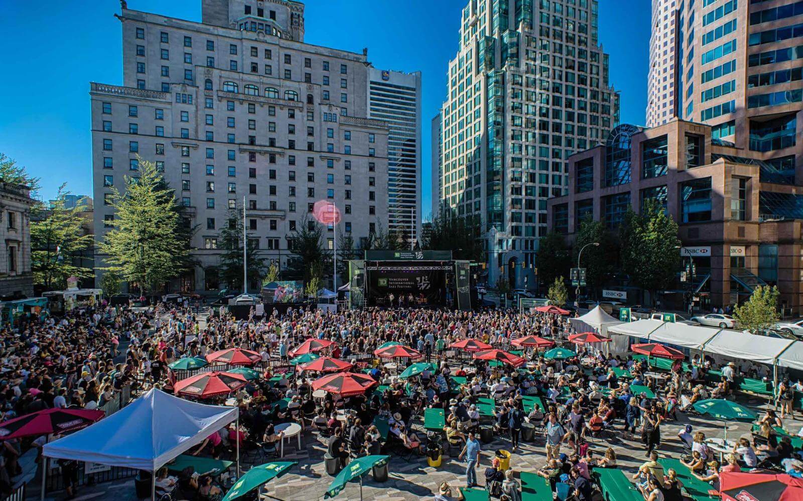 a huge crowd gathered to watch a performance at the jazz festival in downtown vancouver bc canada