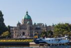 A seaplane in front of the Parliament Building, Victoria BC