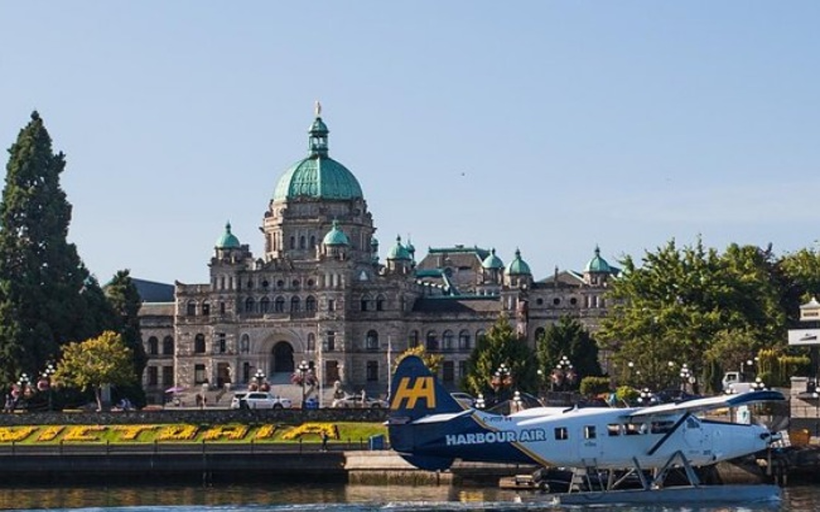 A seaplane in front of the Parliament Building, Victoria BC