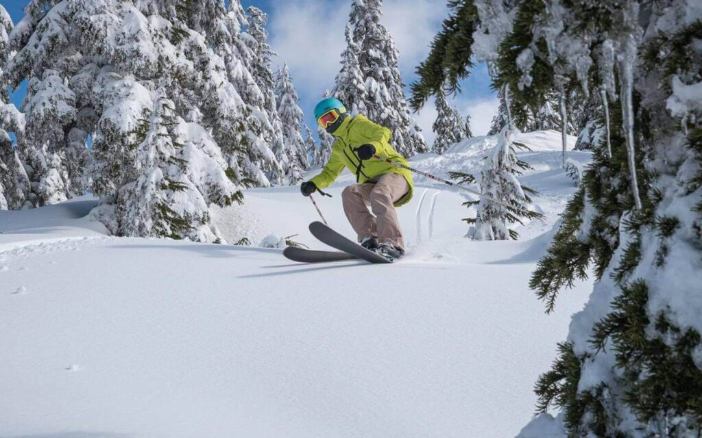 a skier going down the cypress mountain ski hill in vancouver bc canada