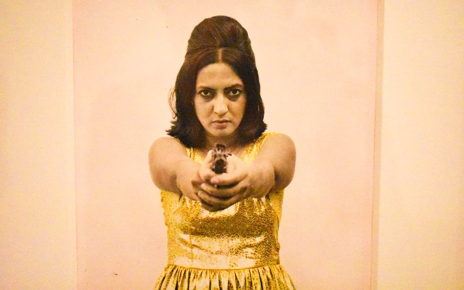 photo of a woman pointing a gun at the vancouver art gallery
