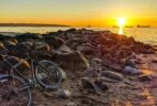 a bike during golden hour at third beach, one of our top Vancouver hidden gems.