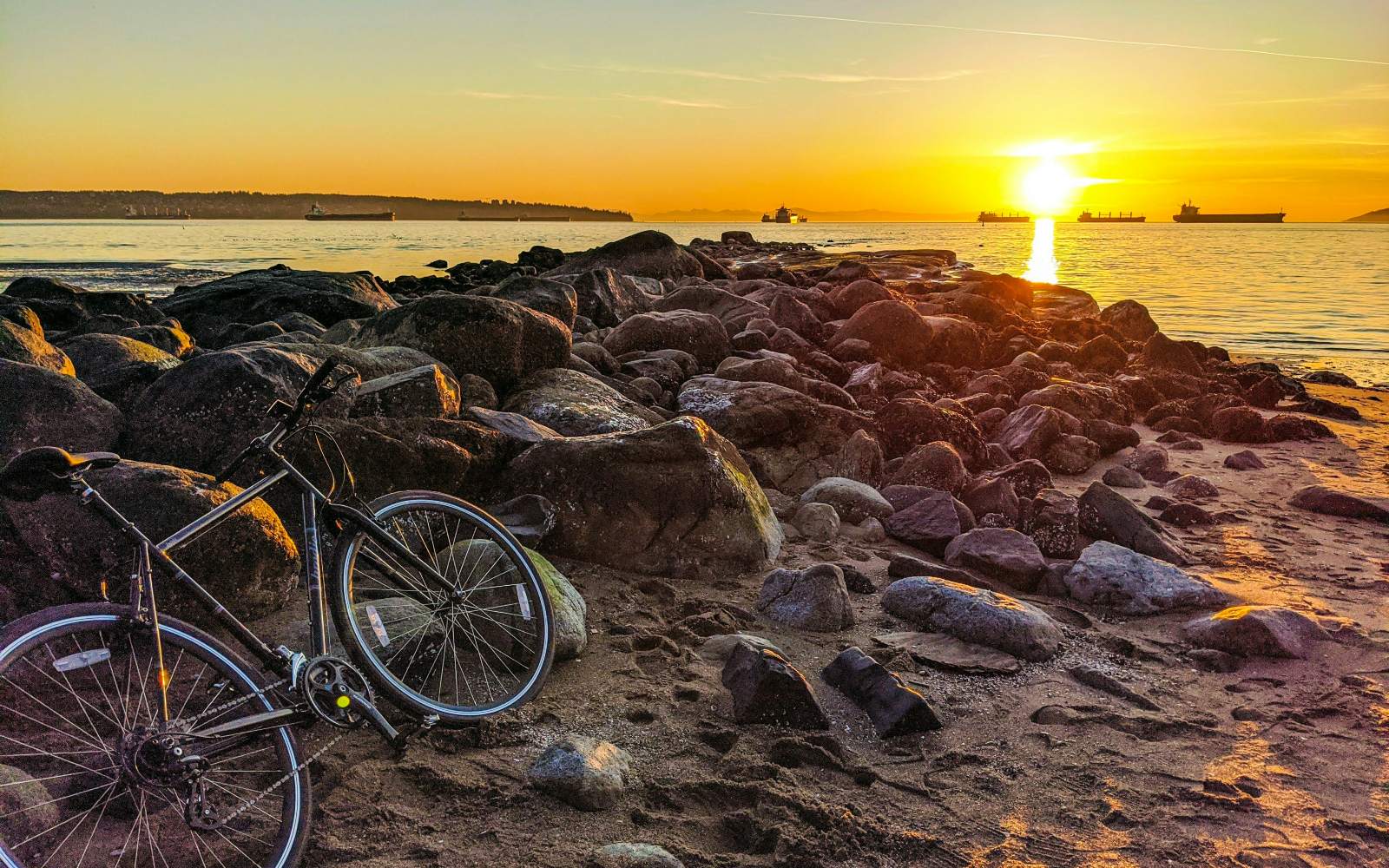 a bike during golden hour at third beach, one of our top Vancouver hidden gems.