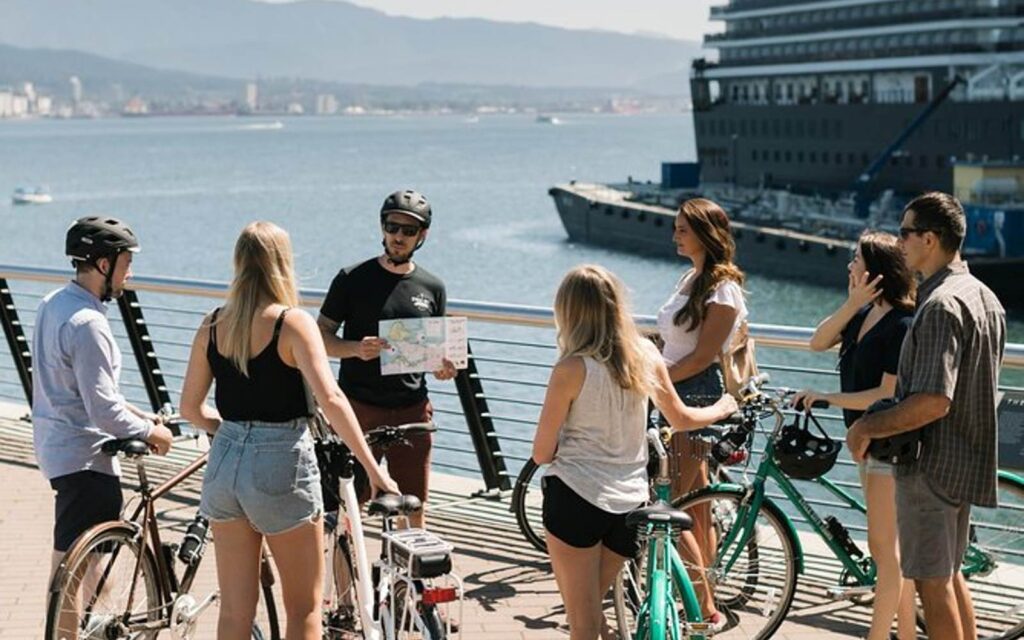 tourists taking a vancouver city tour on ebikes