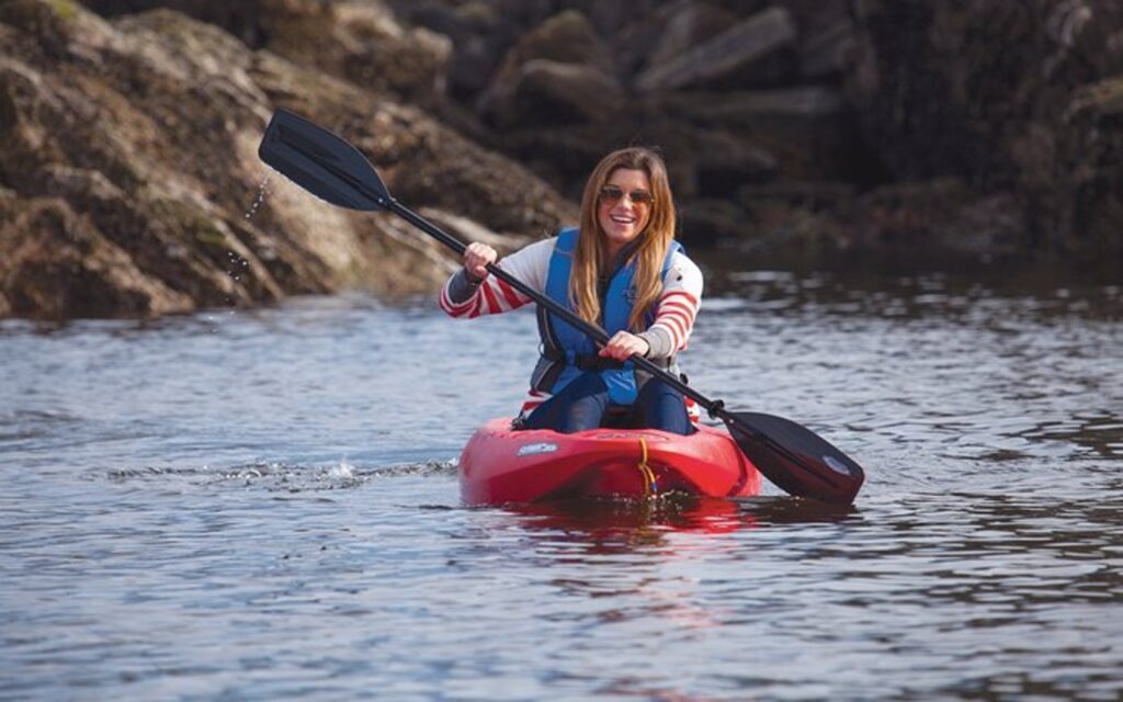 a women enjoys a vancouver kayaking tour