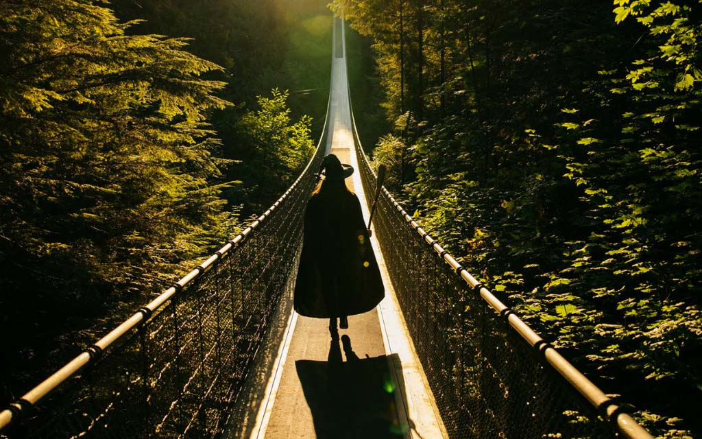 a witch walking on the capilano suspension bridge during canyon frights in vancouver bc canada