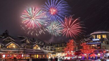 the whistler new year's eve fireworks display illuminates the village stroll.