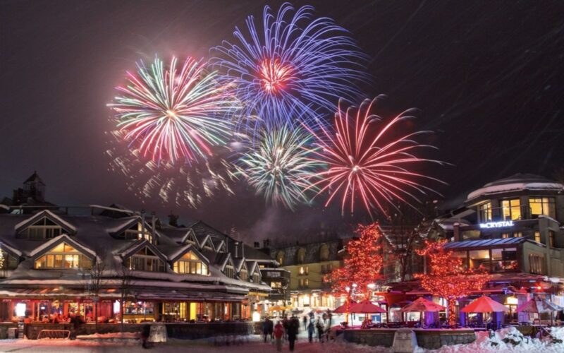 the whistler new year's eve fireworks display illuminates the village stroll.