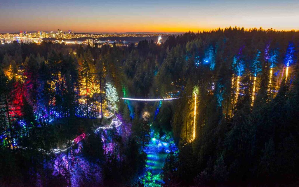 Renowned bridge, aglow from end to end with a dynamic display of changing multi-color lights and gently sway high above the brilliantly illuminated Capilano River.
