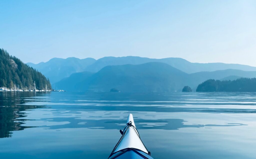 a kayaker enjoys Deep Cove, on of the top Vancouver hidden gems.