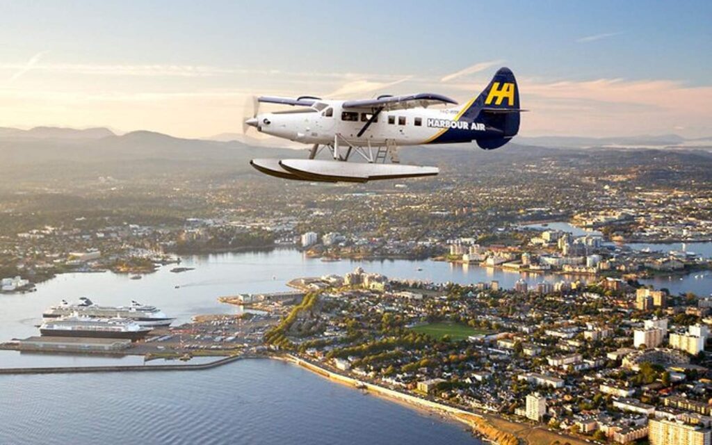 seaplane flying over the city of victoria british columbia