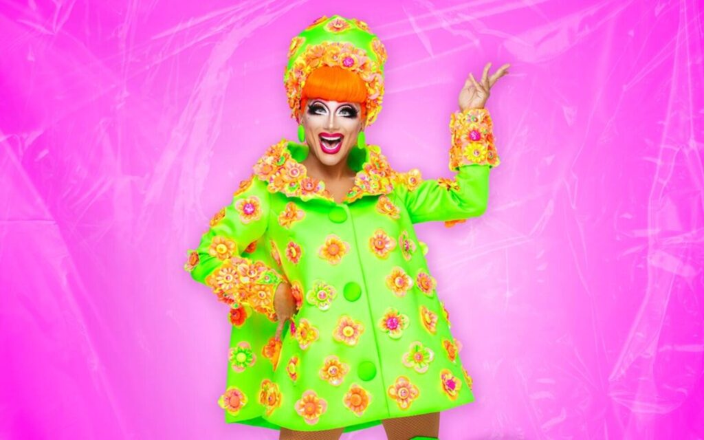bianca del rio poster on dead inside tour wearing green dress on a pink background