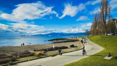 cyclists along sunset beach in vancouver