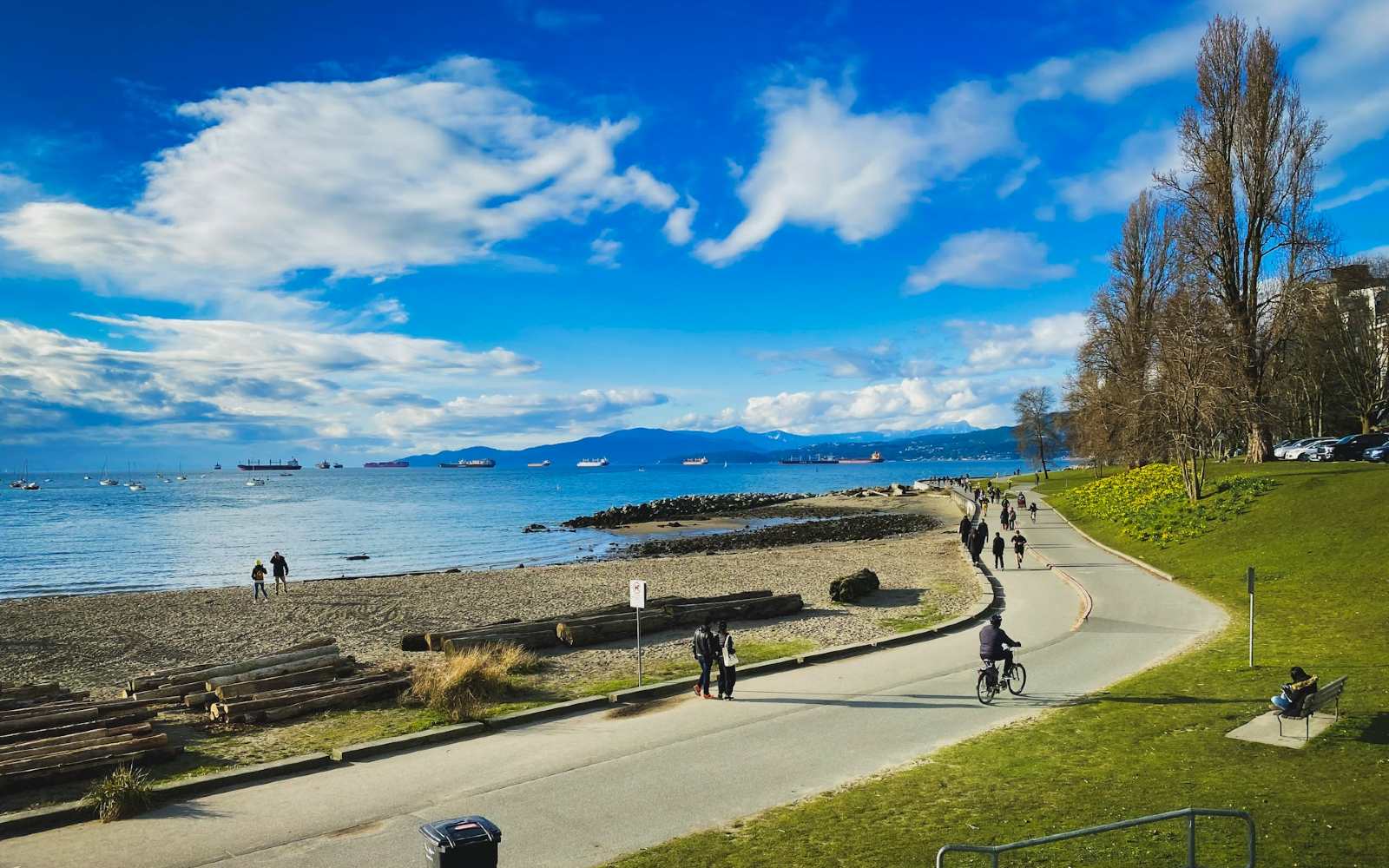 cyclists along sunset beach in vancouver