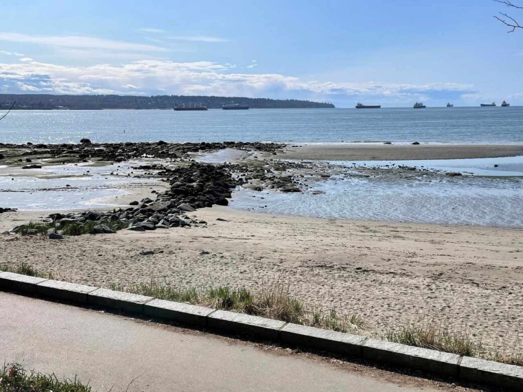 sandy shoreline at second beach one of the beaches in stanley park at a great view while biking at stanley park