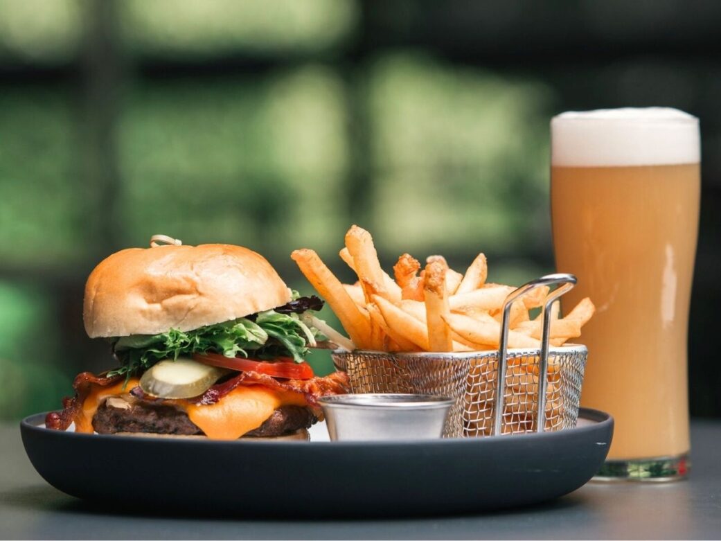 premium burger with a side of fries and ice cold beer one of the restaurants in stanley park