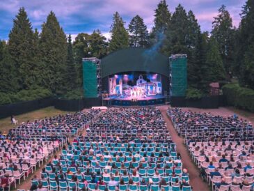 live show at theatre under the stars packed with live audience during a beautiful sunset