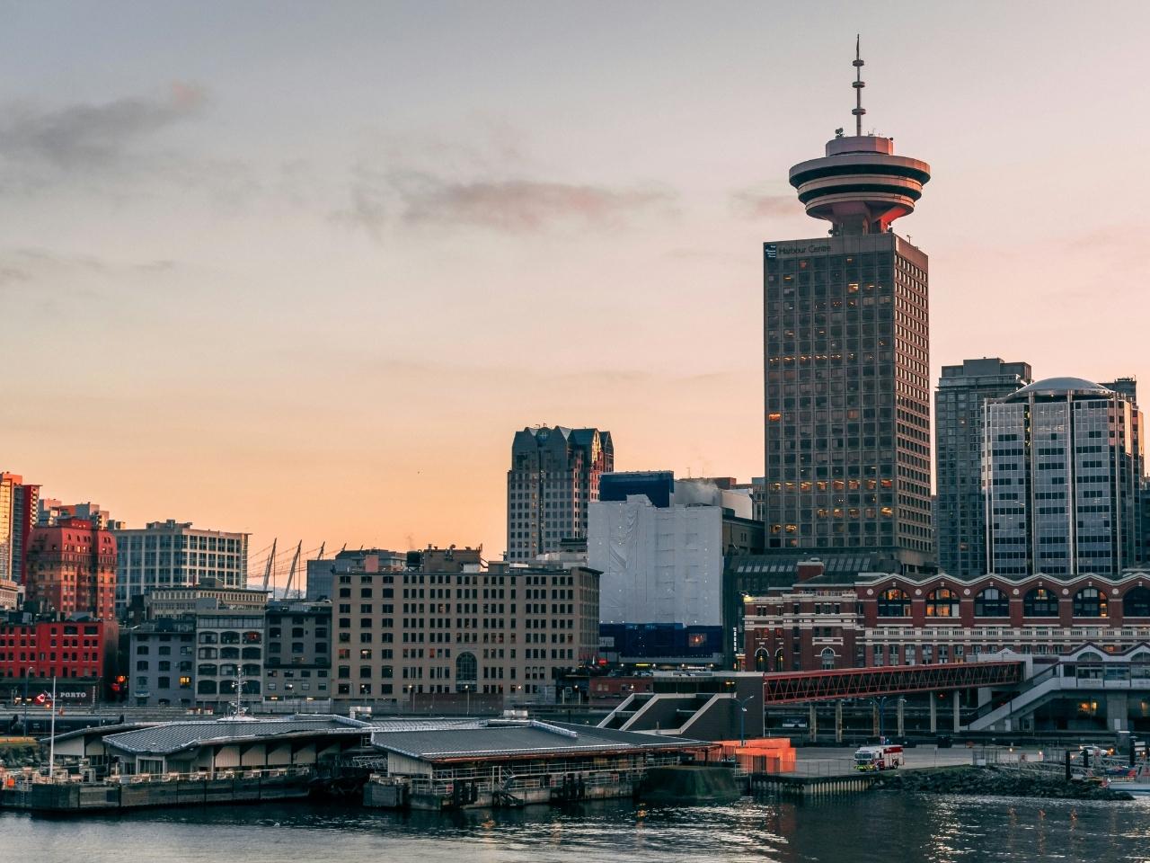 downtown vancouver on a sunset showing off buildings and docking area