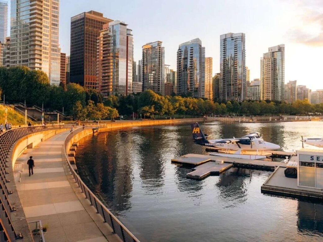 that’s coal harbour vancouver, right near the seawall and floatplane terminal. golden hour lights up the skyline perfectly here—especially if you’re walking toward stanley park or watching a harbour air seaplane take off.
