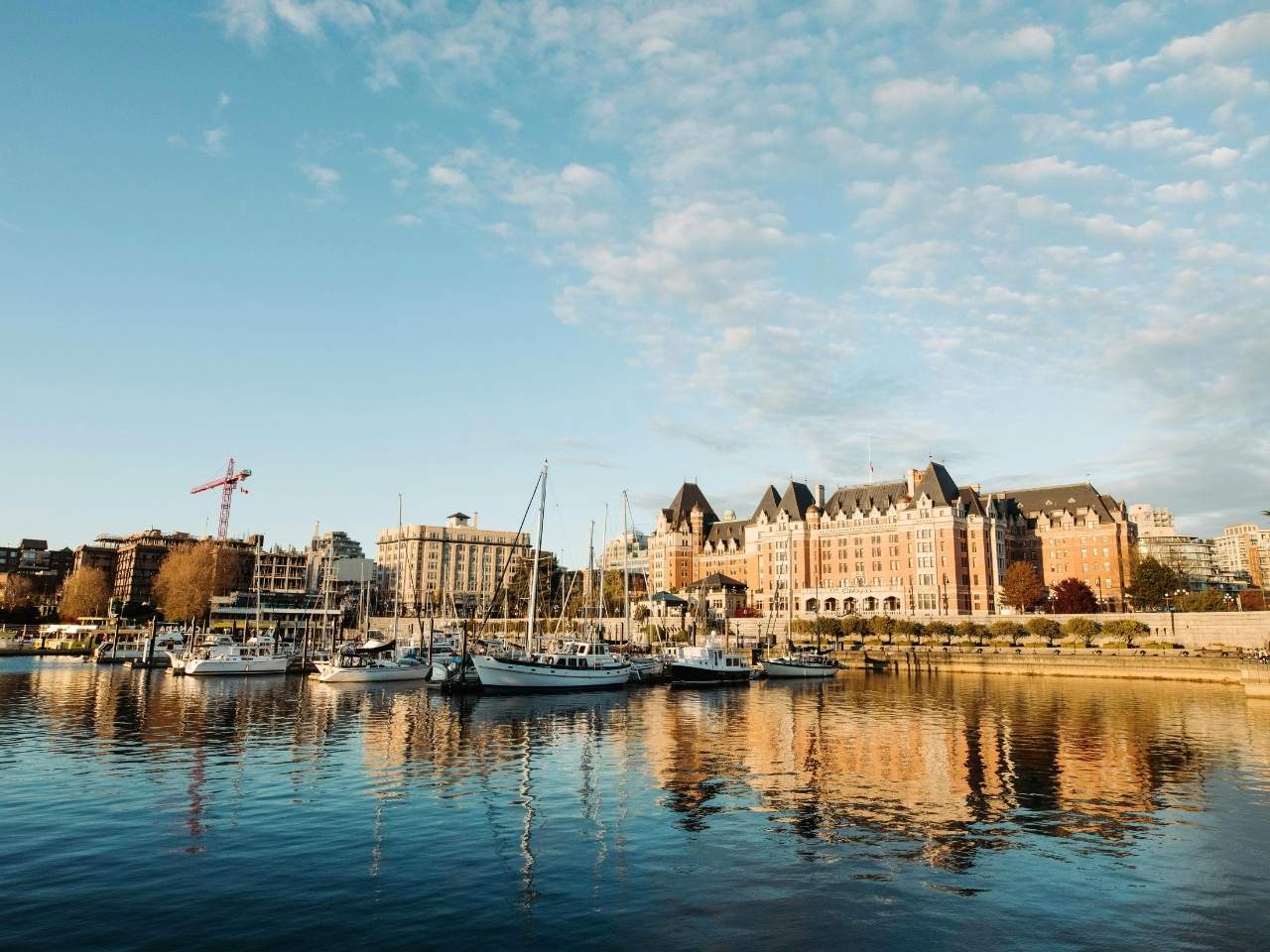 this is victoria’s inner harbour, with the iconic fairmont empress hotel standing proud along the waterfront. calm waters, sailboats, and heritage architecture make this a perfect welcome if you're arriving from seattle by ferry or seaplane.