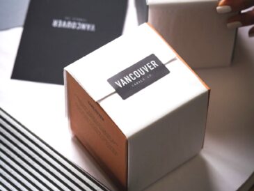 a white box with a black sticker on top with vancouver printed on it